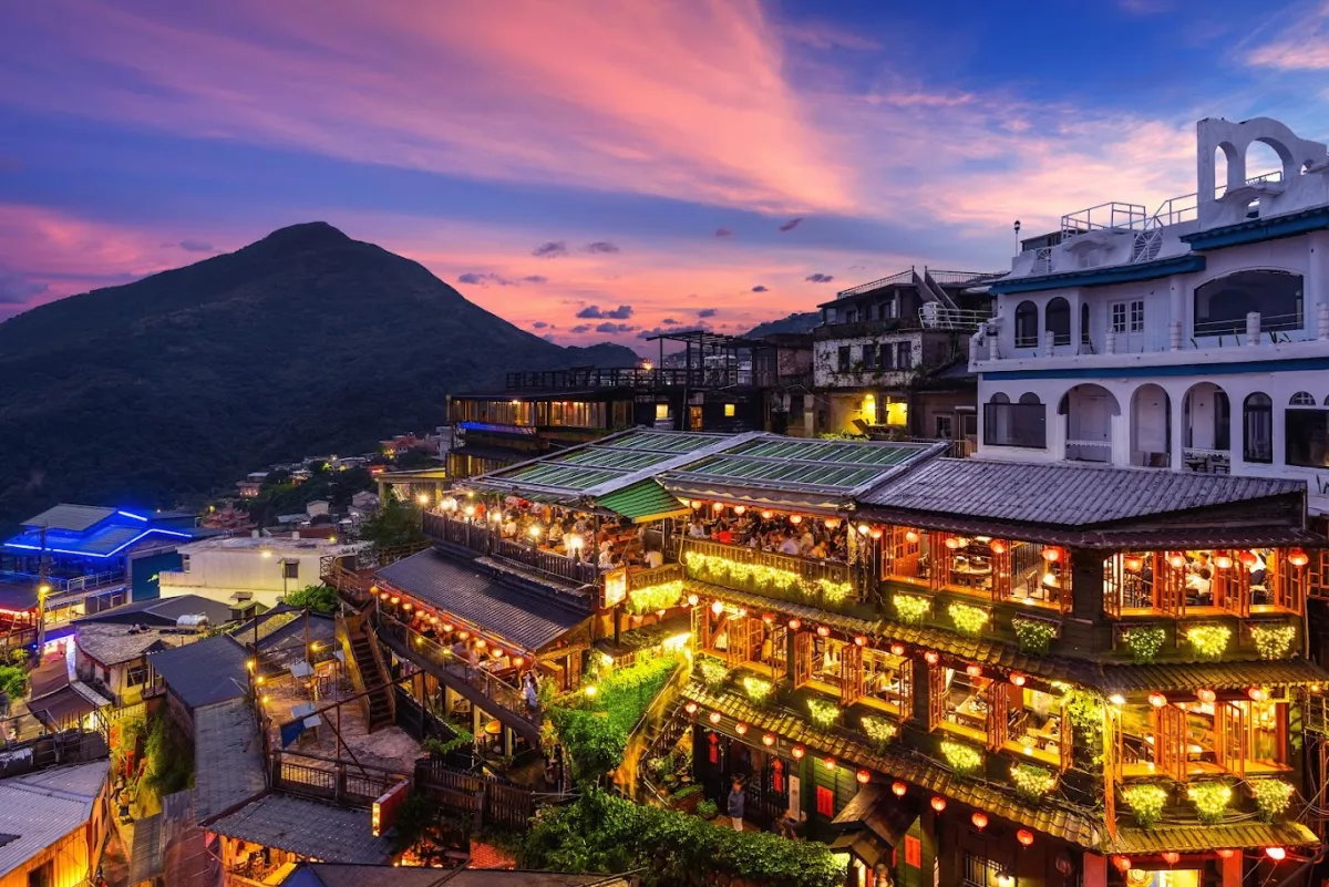 Jiufen streets illuminated at twilight.